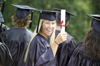 Smiling Graduate with Diploma --- Image by © Tom Grill/Corbis